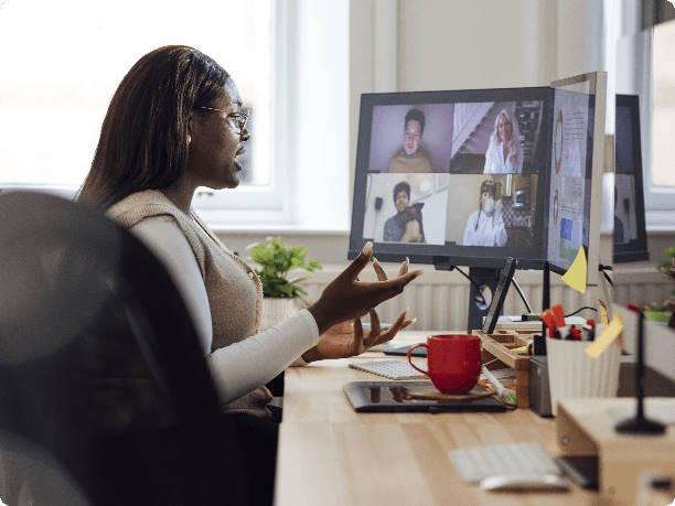A therapist on a video call at her desk